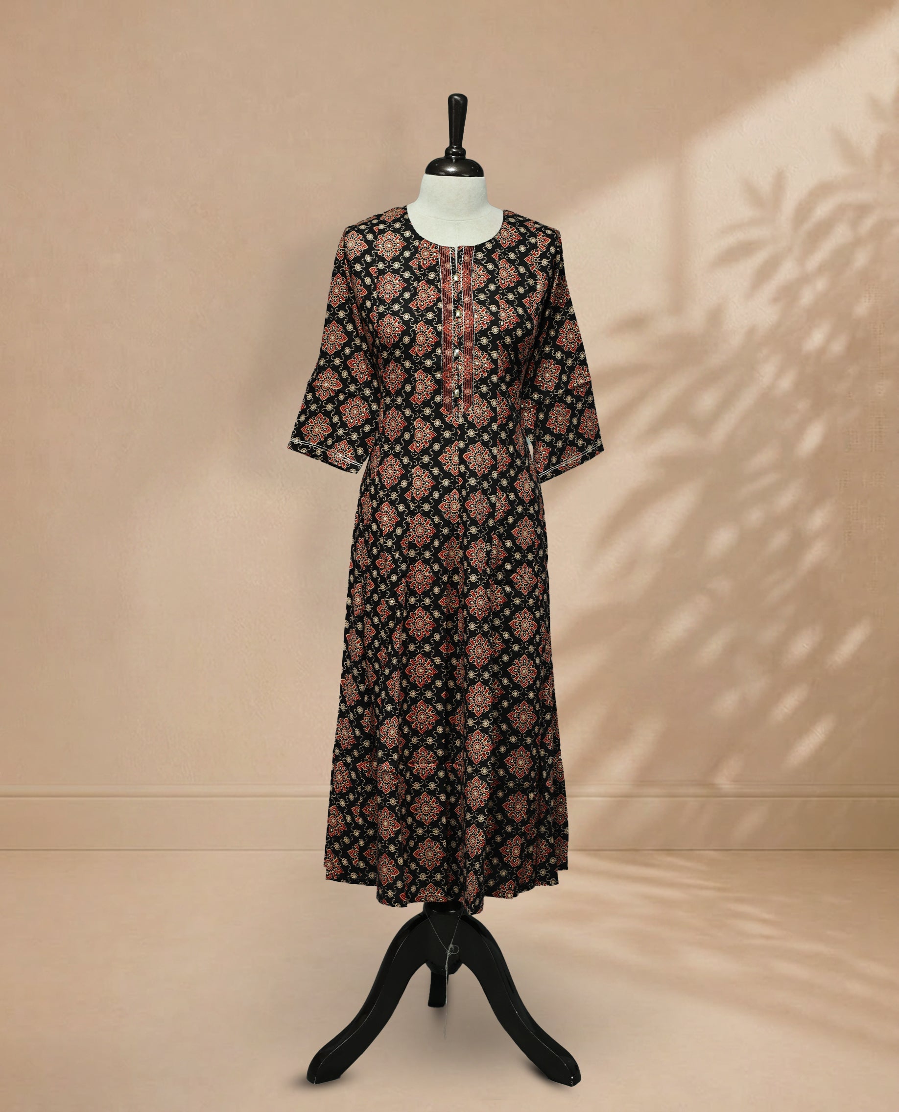 Black colour kurti featuring classic u neckline,  floral prints on body, Comes with sleeve.