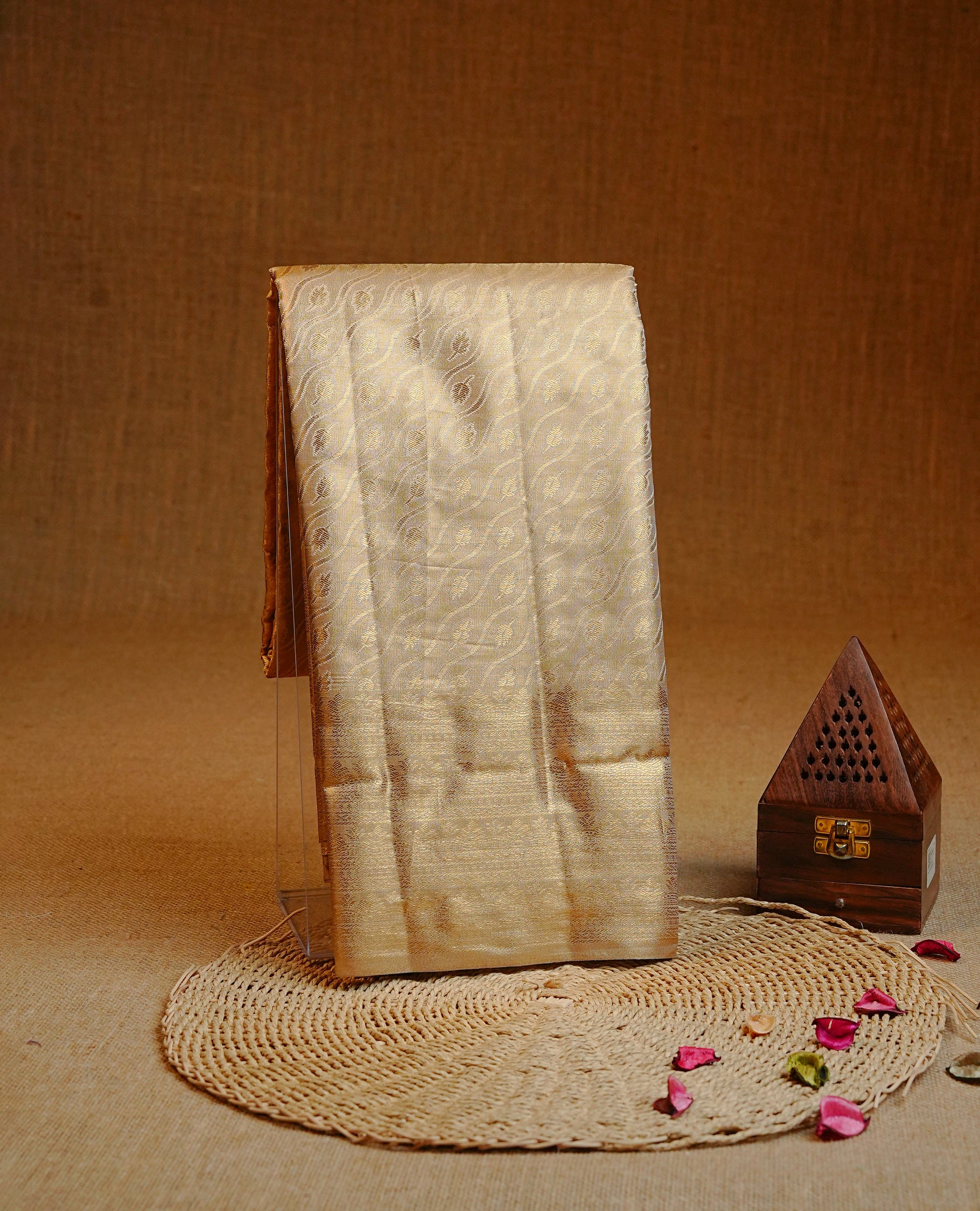 Gold colour Double shade Semi tissue silk saree featuring Light gold zari Wavy & leaf pattern on body, self colour with traditional border, paired with matching.
