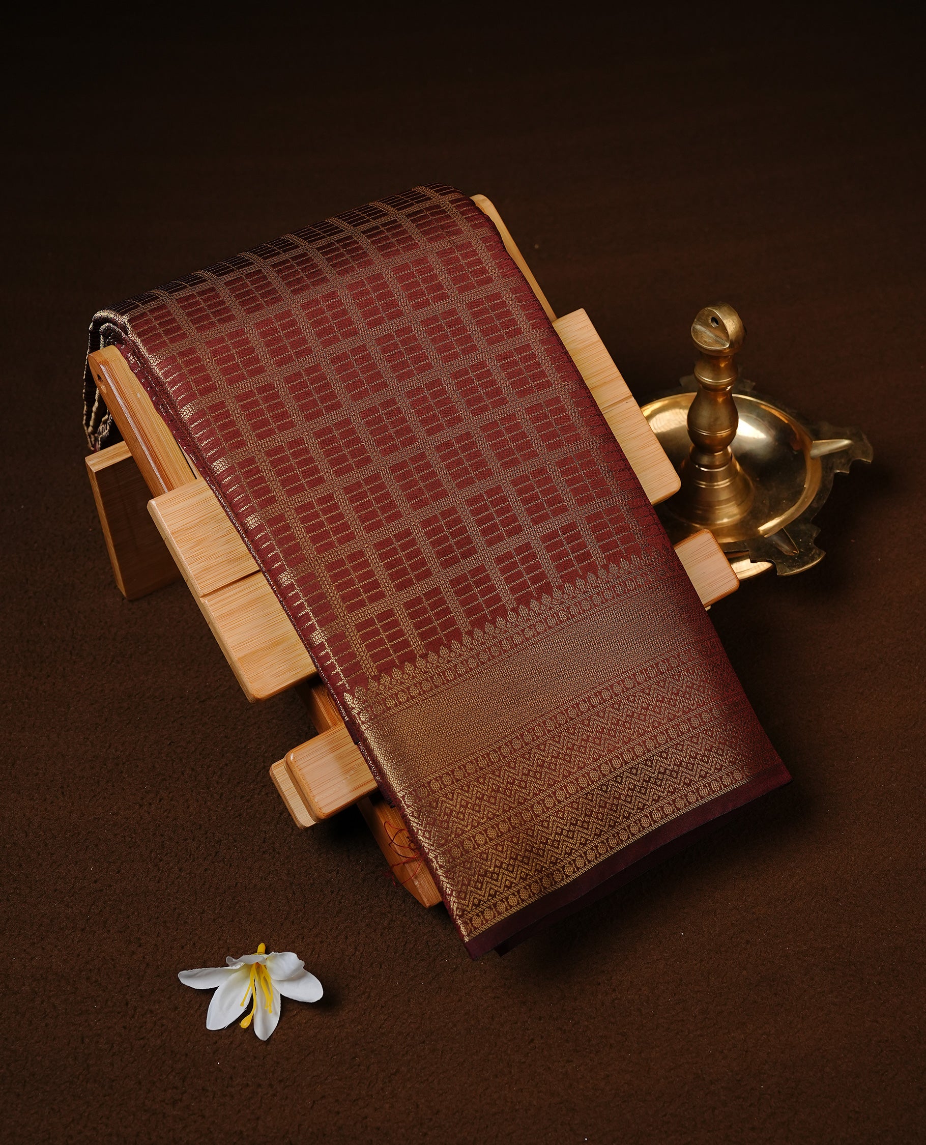 Chocolate brown colour Semi Wedding silk saree featuring Gold zari Check pattern across body, enhanced with self colour with traditional border, paired with matching blouse piece.