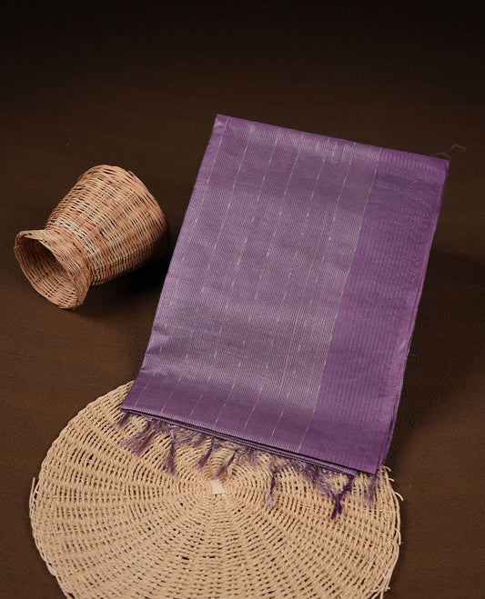 Purple colour semi jute saree highlighting gold zari striped body, without border and paired with matching blouse.