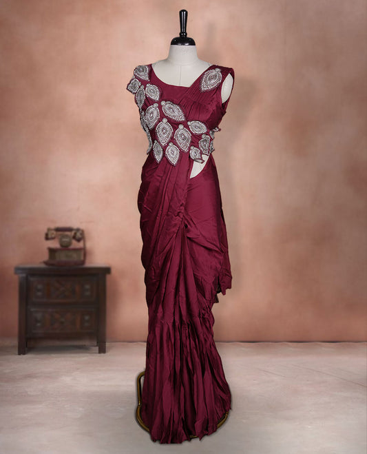 Deep Red colour ready to wear saree featuring bold silver applique embroidery on the drape, paired with a sculpted matching blouse.