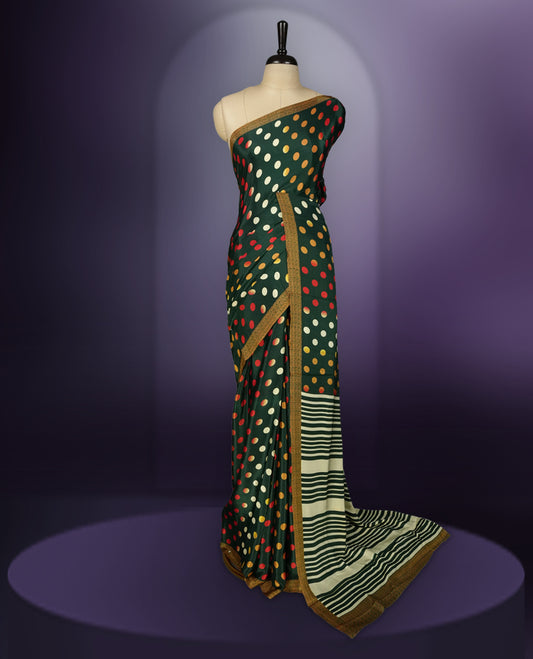 Green colour saree with with large big polka dots on the body, self stripped pallu & Comes with a stylish matching blouse.