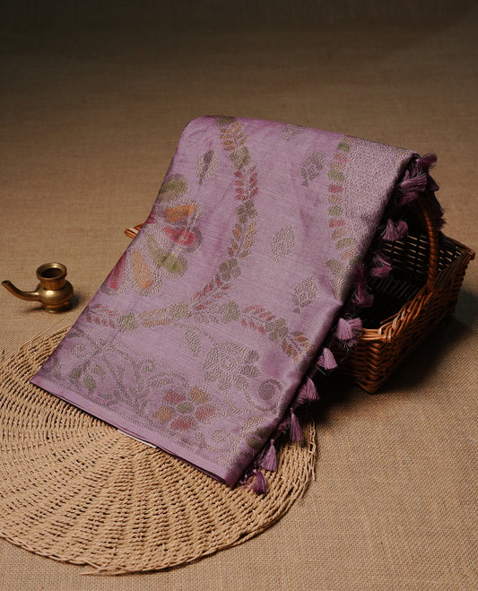 Pastel purple colour pure tussar silk saree featuring elegant antique zari kodi patterns across the body, designed with a graceful borderless finish for a refined look. Paired with a matching blouse piece.