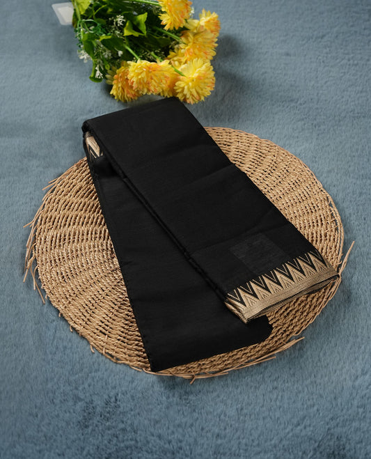 Black colour Narayanapattu cotton saree featuring a self coloured body, contrast  cream colour zari border and pallu, pairing a matching blouse piece.