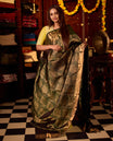 Deep green pure Kancheepuram silk saree featuring elegant gold zari Motifs, a rich gold zari pallu, and a broad gold zari border, paired with a matching blouse.