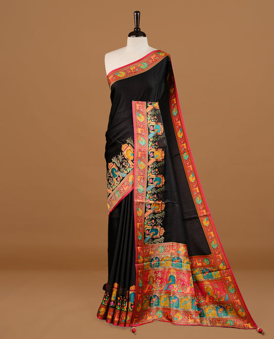 Black colour Pashmina Saree featuring elegant woven temple motifs, enhanced with a contrast pink woven border and a richly detailed traditional pallu, paired with a matching blouse piece.