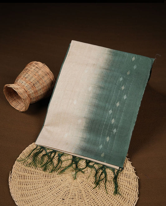 Cream & Green dye pattern colour semi jute saree highlighting white stripped body, without border and paired with matching blouse.