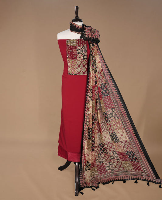 Red colour georgette salwar suit collection featuring plain body enhanced with elegant black bunch kalamkari print on neck yoke, detailed with subtle mirror work , paired with kalamkari printed dupatta with mirror work with santon material bottom.