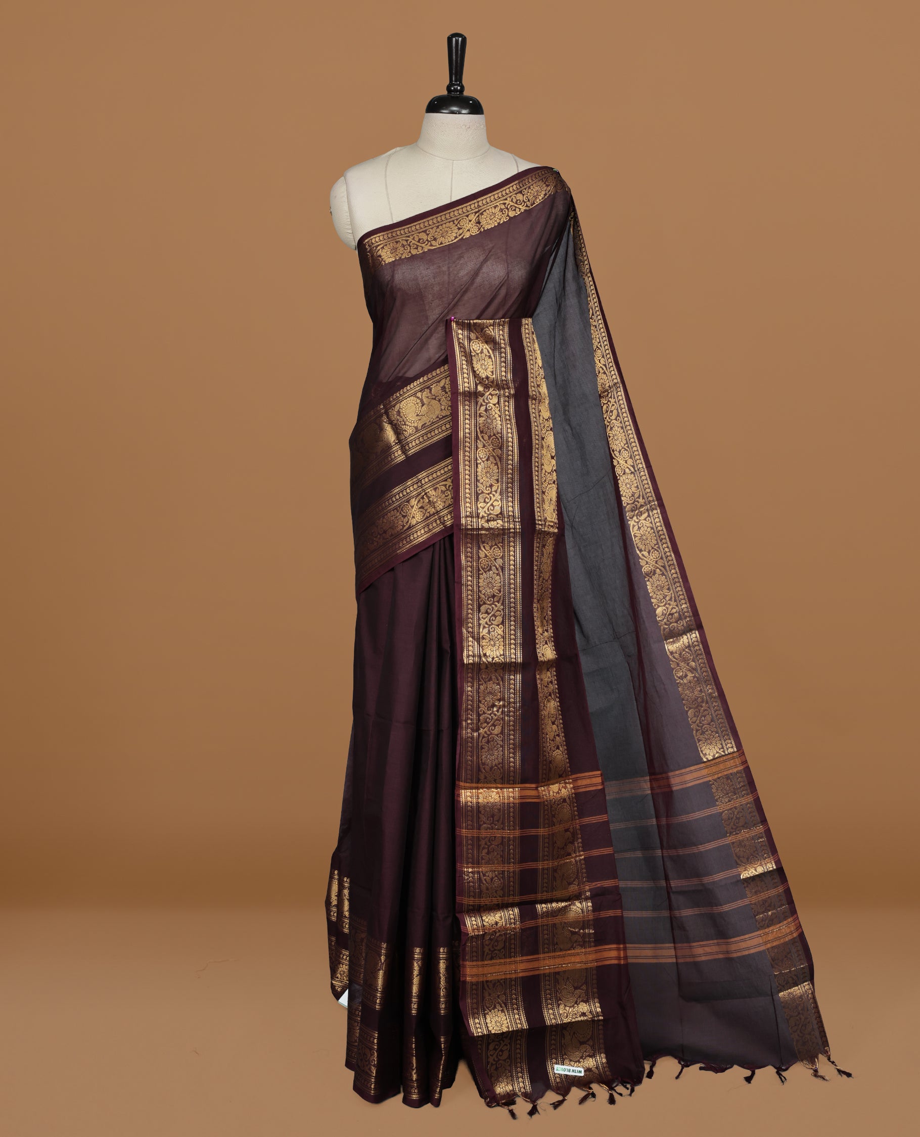 Chocolate Brown colour Chettinad cotton saree featuring Elegant plain body , complemented by self colour with zari border, comes with matching blouse piece.