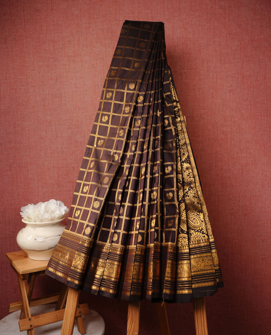 Chocolate colour soft silk saree featuring Gold zari check & motifs on body, complemented by self colour with traditional border, paired with matching blouse piece.