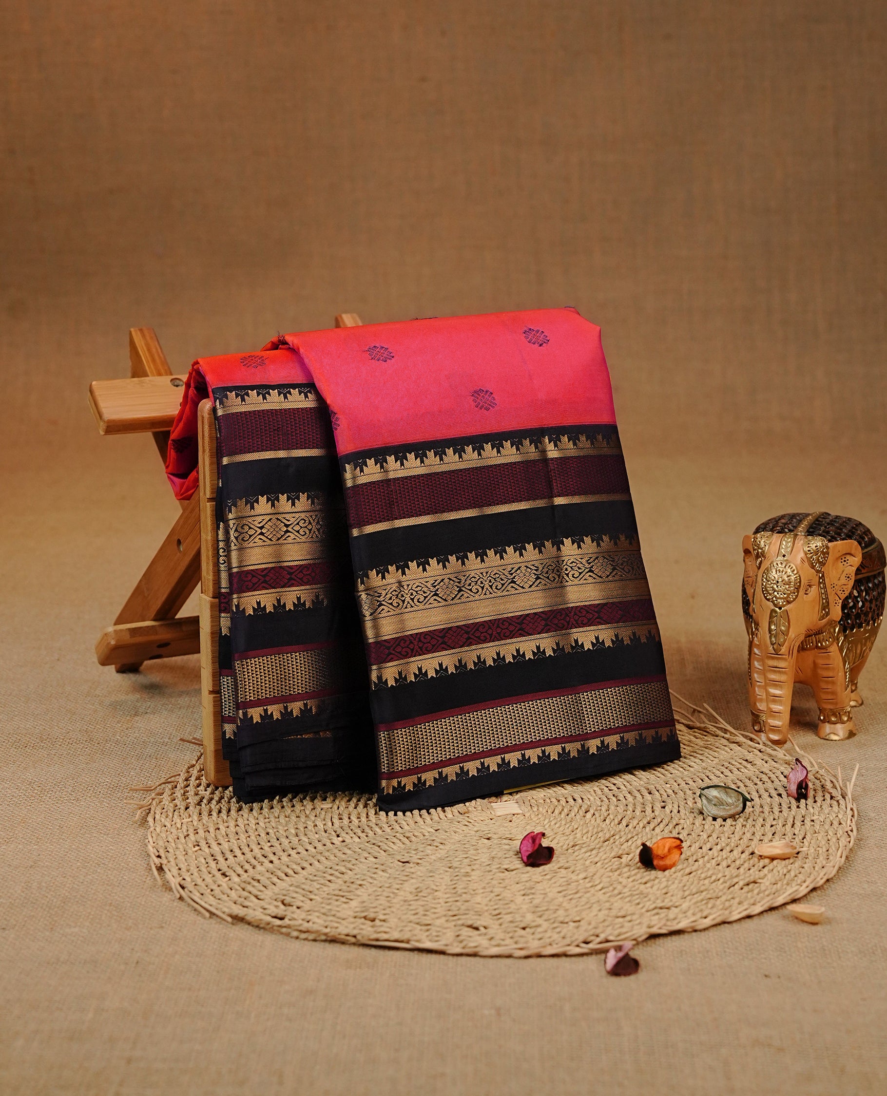 Orange & Pink Double shade Kancheepuram silk saree featuring  Motifs on body, complemented by Multicolour with Traditional border, comes with matching blouse piece.