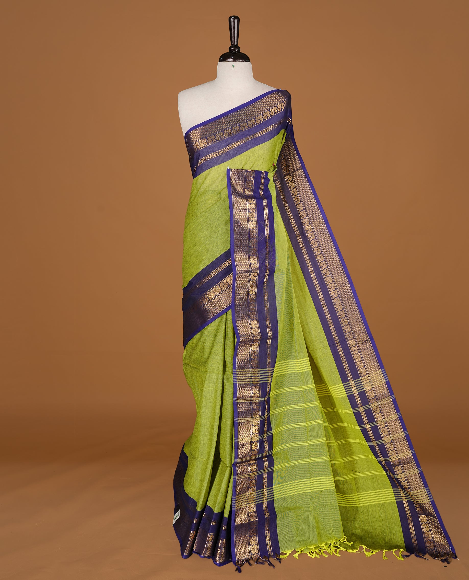 Lemon green Colour Chettinad cotton saree featuring elegant plain body , complemented by contrast Navy blue colour with traditional border, comes with matching blouse piece.