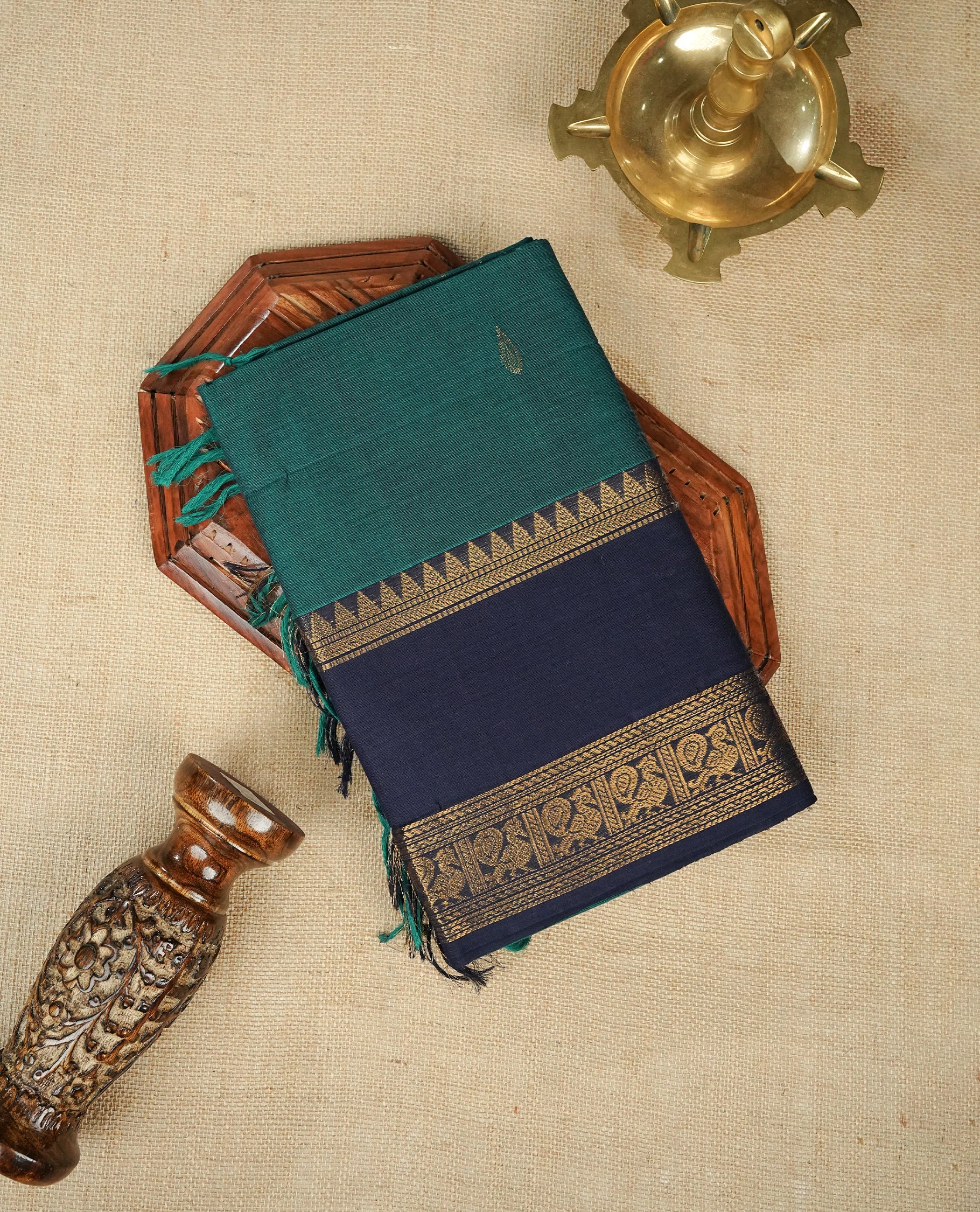 Teal colour chettinad cotton saree featuring Elegant plain body,Contrast Blue colour with Gold zari border, comes with matching blouse piece.