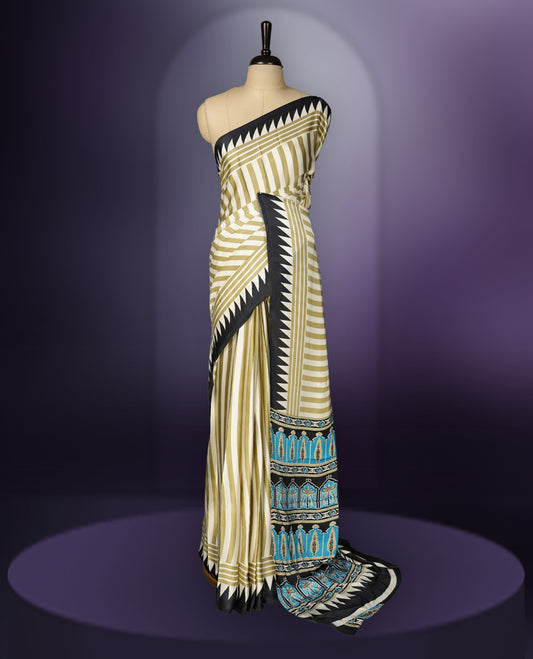 Beige colour saree with olive green stripes, highlighted by a striking black geometric border and a beautifully patterned pallu with intricate motifs, comes with a matching blouse.