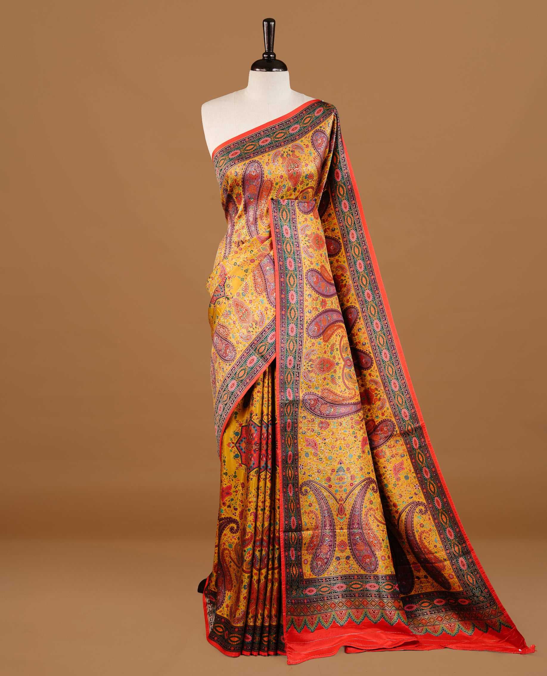 Mustard yellow colour Pashmina Saree featuring multicolour floral and paisley woven body, a contrast multicolour geometric border with red edging, an ornate paisley woven pallu, paired with a matching blouse.