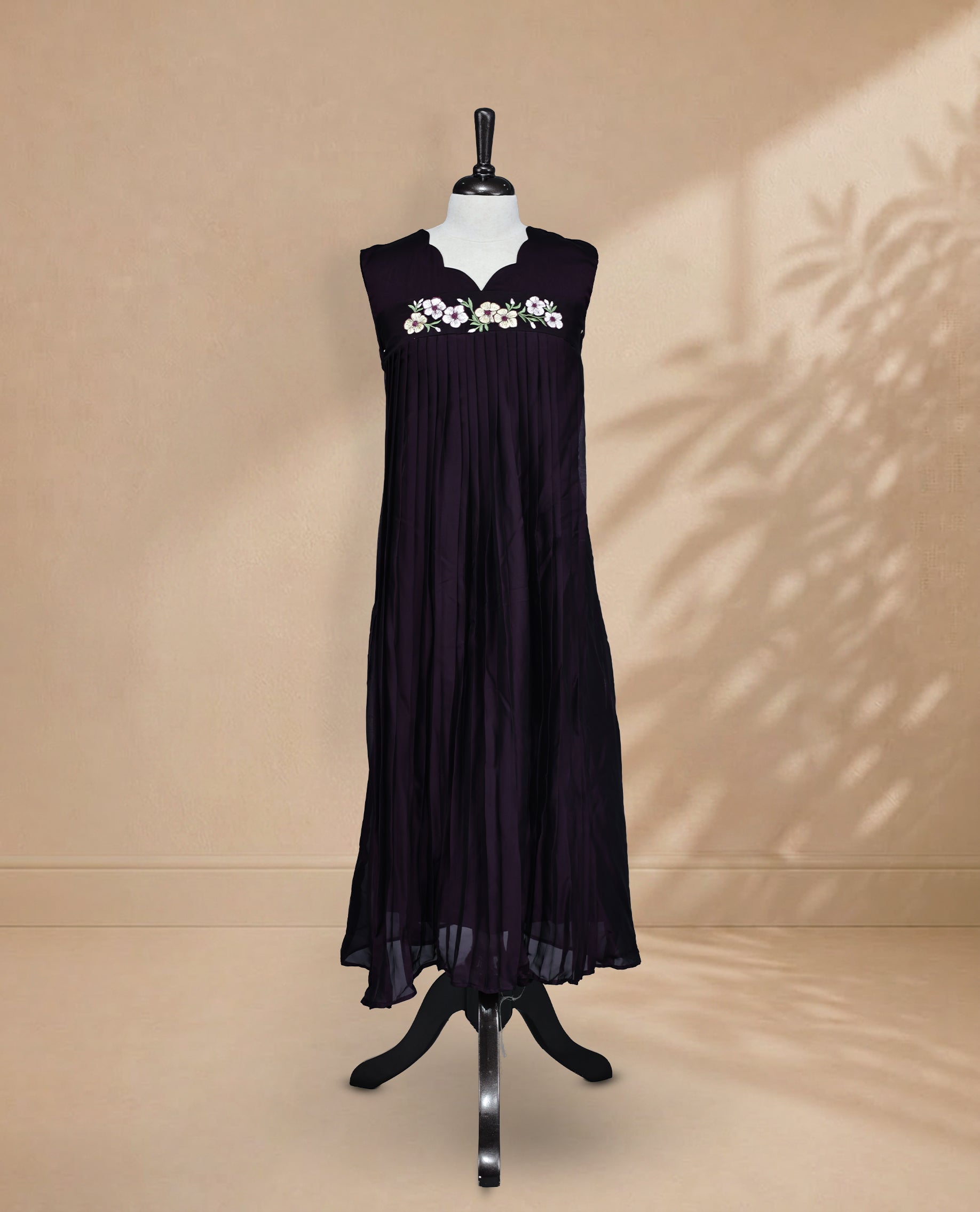 Deep Purple Coloured Sleeveless Kurti Featuring a Designed Neckline, Floral Embroidery on the Body