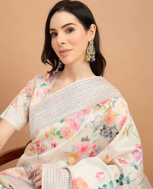 Cream toned semi tussar saree featuring delicate multicolour floral prints on the body, accented with a pastel hued Katha style stitched border and blue & yellow printed pallu Comes with a matching floral printed blouse for a graceful look.