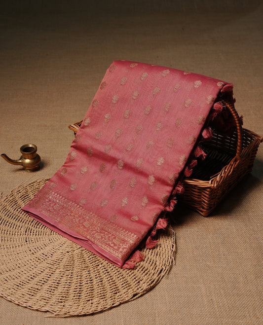 Candy pink colour semi tussar silk saree featuring elegant gold zari motifs across the body, designed with a subtle borderless zari finish for a sophisticated traditional look. Paired with a matching blouse piece.