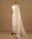Cream colour churidhar material featuring cut beads and sequins work on the body, paired with a matching unstitched bottom and worked dupatta.