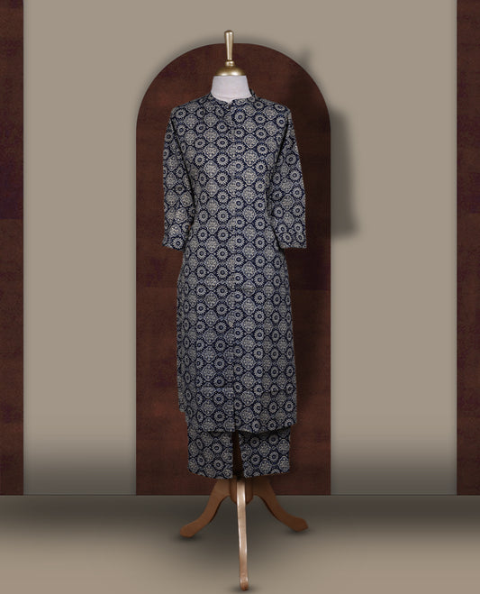 Navy blue colour coord set with floral prints all over,  featuring a smart mandarin collar and 3/4 sleeves, Paired with matching straight pants, it blends elegance and comfort for a chic everyday or casual outing look.
