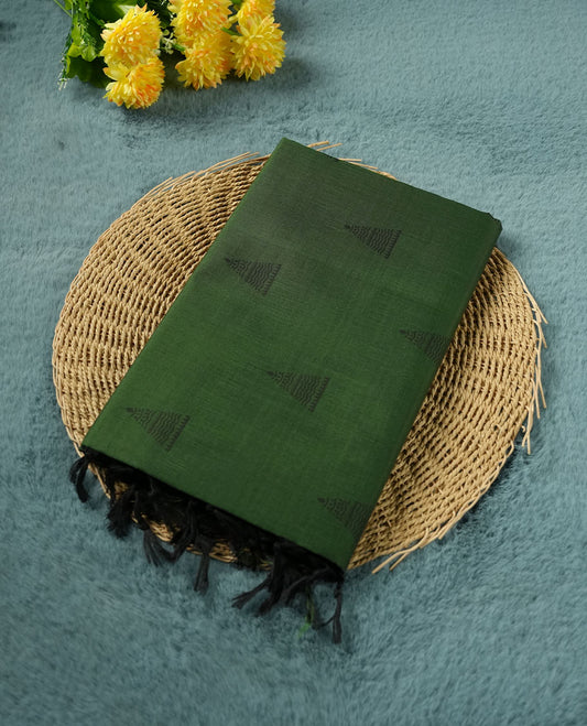 Dark Green colour poly cotton saree with black temple motifs on the body, paired with a matching pallu with black woven traditional border, and a coordinated all‑over geometric printed blouse piece.