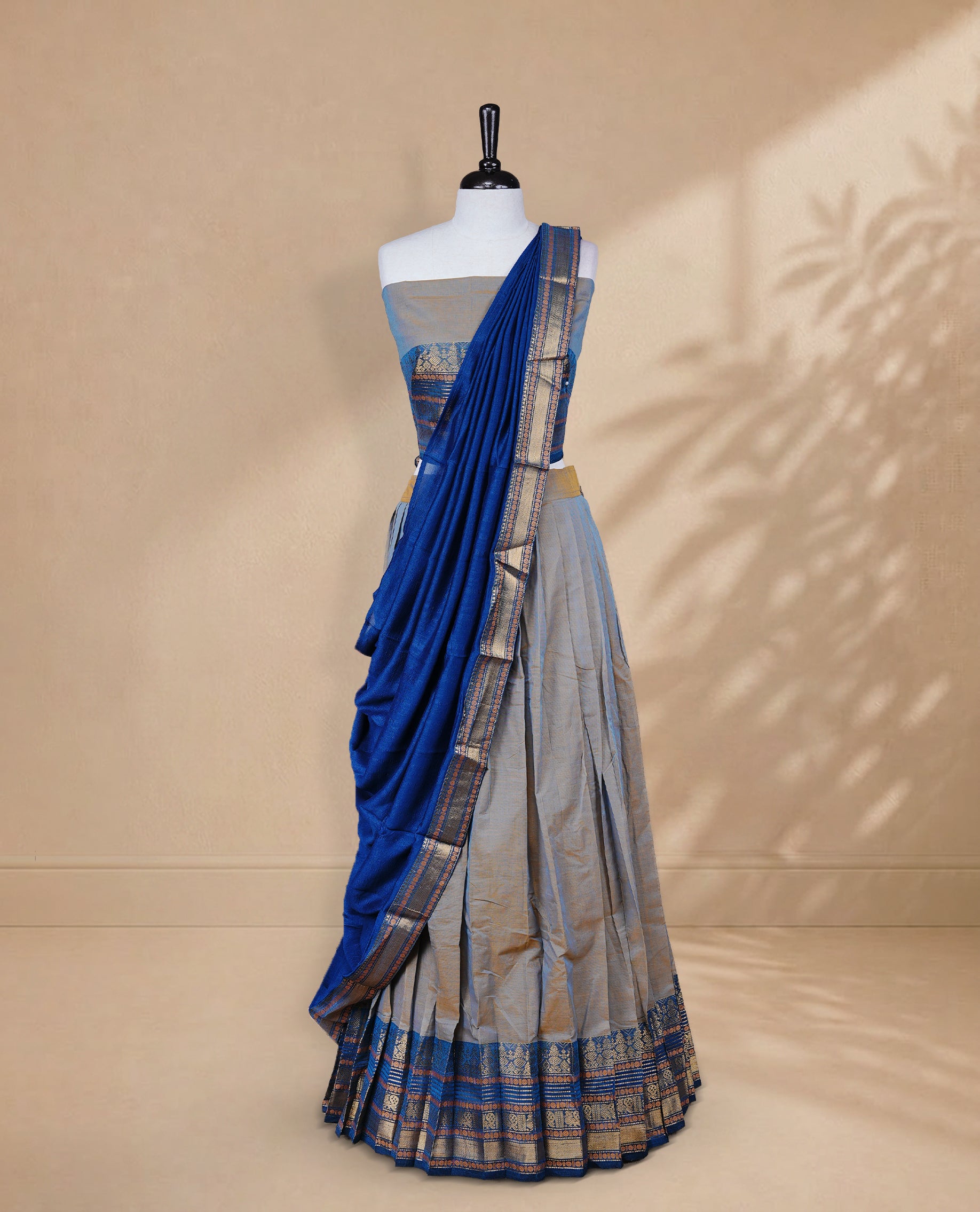Golden & Blue double shade colour Half saree featuring Plain skirt with Zari border on contrast Teal colour border, Unstitched Blouse and matching dupatta.