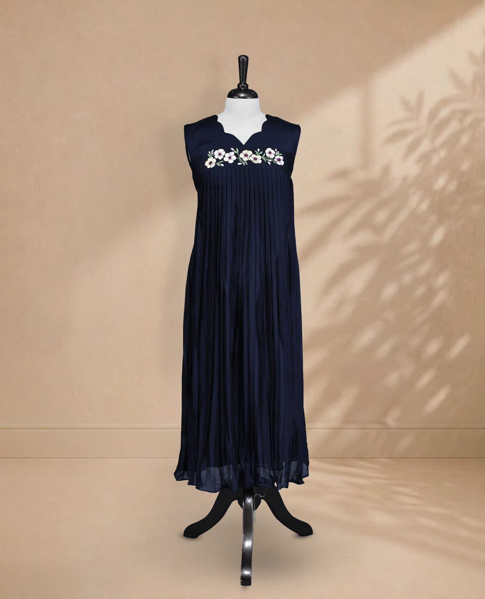 Navy Blue  Coloured Sleeveless Kurti Featuring a Designed Neckline, Floral Embroidery on the Body