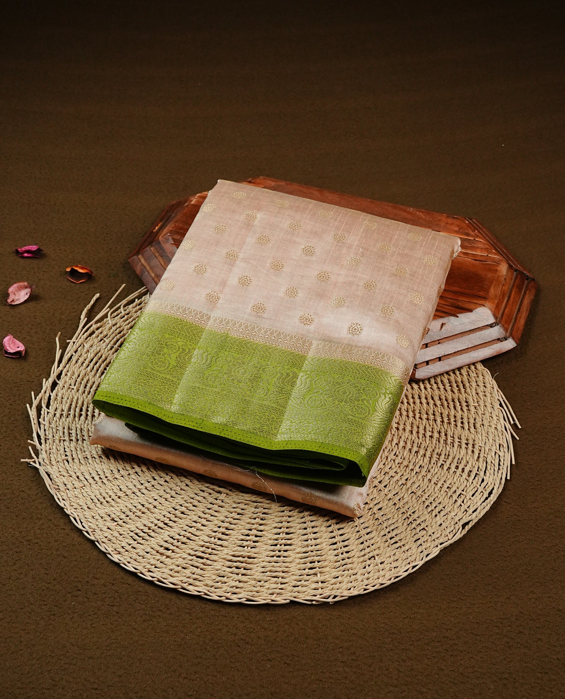 Light Gold Tussar saree featuring Gold zari buttas on body, complemented by contrast light green Colour with Gold zari border, comes with matching blouse piece.