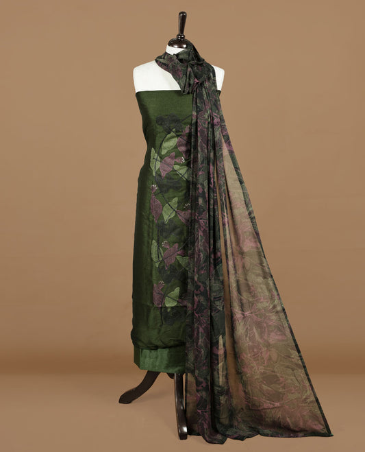 Dark green colour churidar material featuring thread & sequins Worked pattern on body, comes with matching bottom and dupatta.