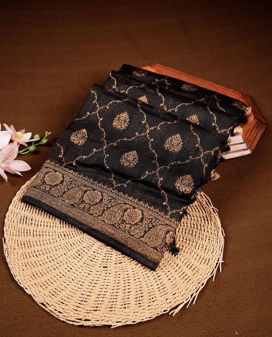 Black colour semi Banaras saree with gold zari buta motifs, finished with a traditional gold zari border and pallu, paired with a matching blouse.