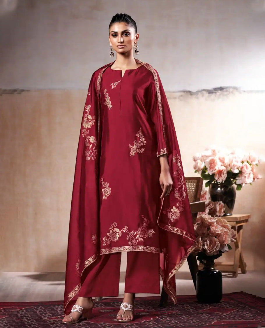 Wine Maroon colour suit material with pakiza silk top featuring delicate embroidery on the body and sleeves, paired with matching satin bottom and embroidered lace border dupatta.