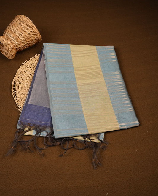 Green and light teal colour semi tussar silk saree, featuring an intricate gold zari stripes on body and pallu , comes with matching blouse.