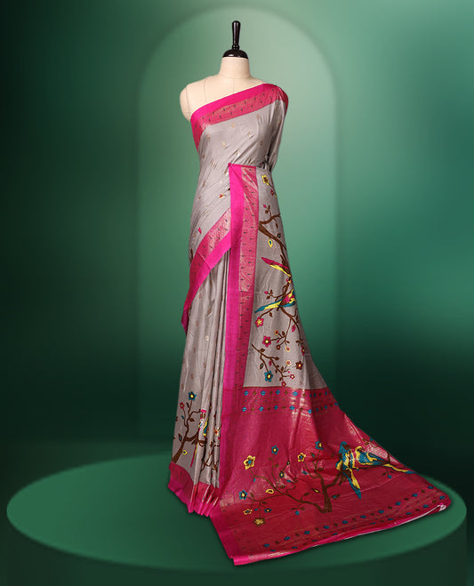 Grey colour saree adorned with delicate woven motifs on the body, enhanced with a vibrant Pink border, complemented by a colourful printed pallu featuring floral and bird designs, and paired with a matching blouse