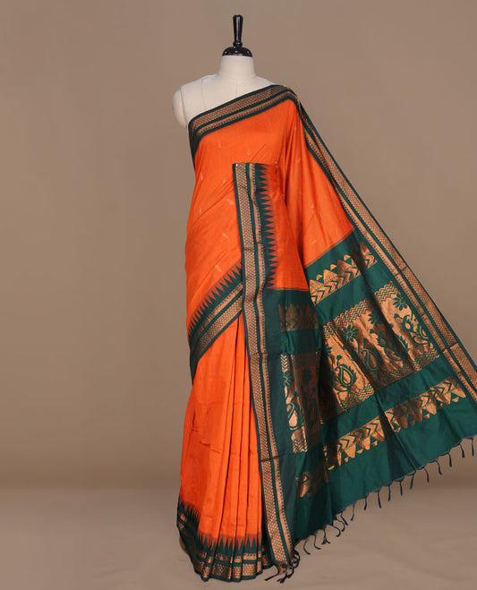 Orange colour kalyani cotton saree featuring gold zari motifs on body, complemented by contrast green color with gold zari pattern border , paired with matching blouse piece.
