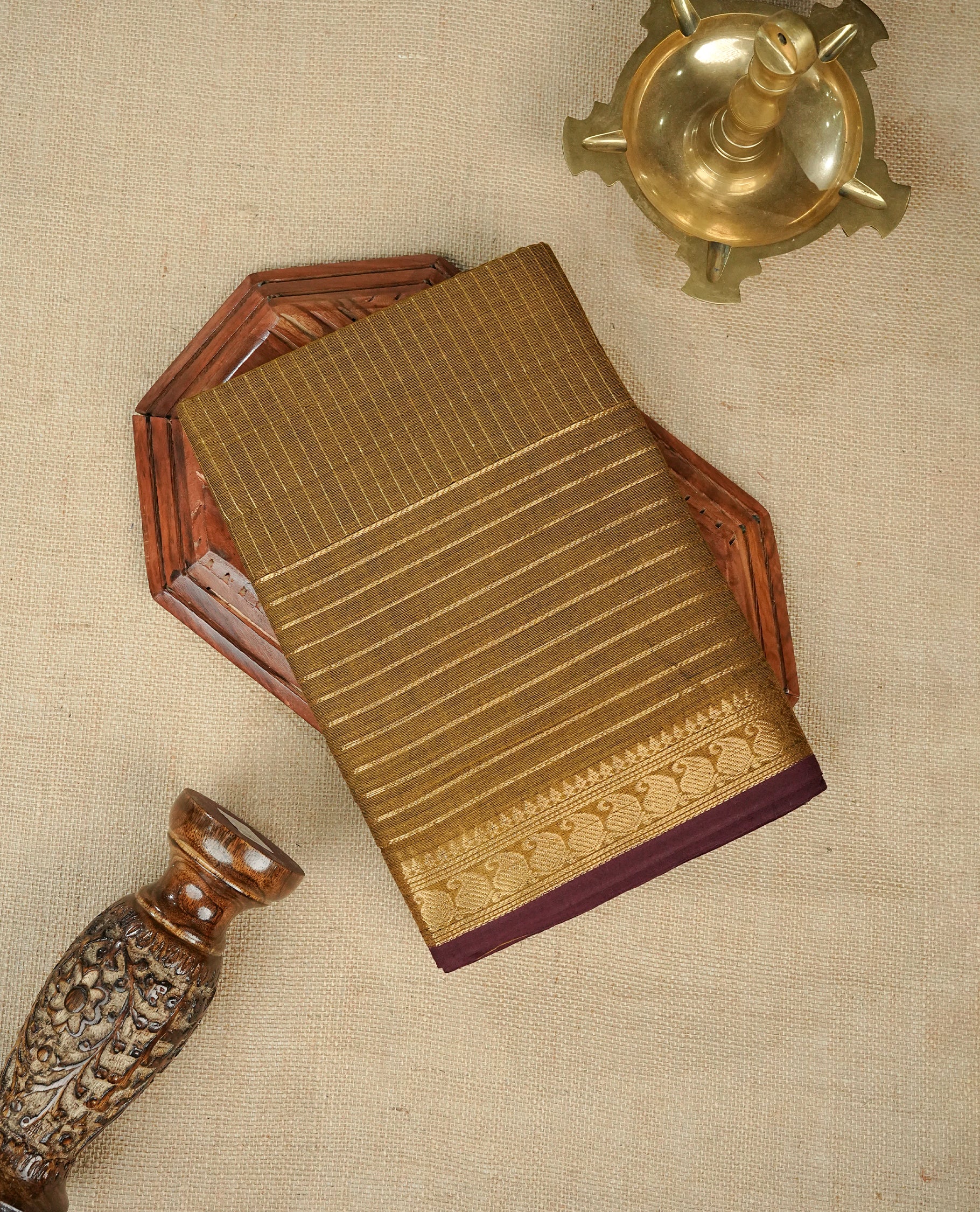 Olive colour chettinad cotton saree featuring gold zari strips body, gold zari Strips border, comes with matching blouse piece.