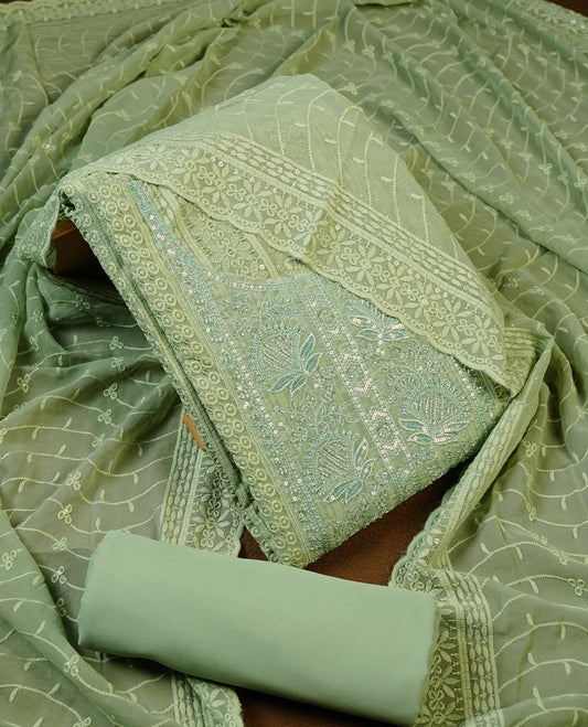 Pastel green colour churidhar Material featuring Intricate Thread Embroidery with Mirror and Cut Beads Work on the Front Panel, paired with an All Over Embroidered Net Dupatta and Matching Bottom