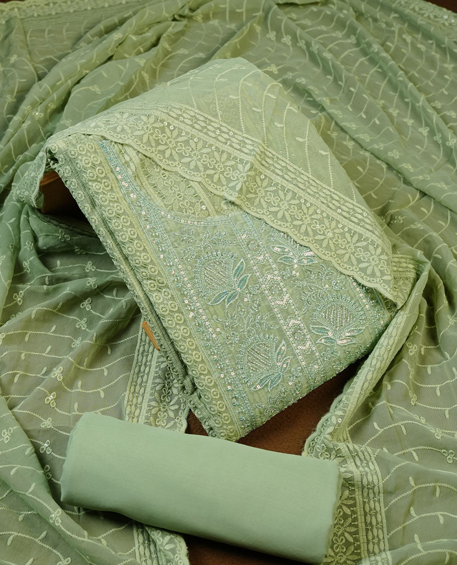Pastel green colour churidhar Material featuring Intricate Thread Embroidery with Mirror and Cut Beads Work on the Front Panel, paired with an All Over Embroidered Net Dupatta and Matching Bottom