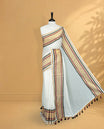 Off White Colour Mul Cotton Saree featuring Elegant Plain Body, Contrast Gold, Wine & black Border and Tassels Onam inspired charm.