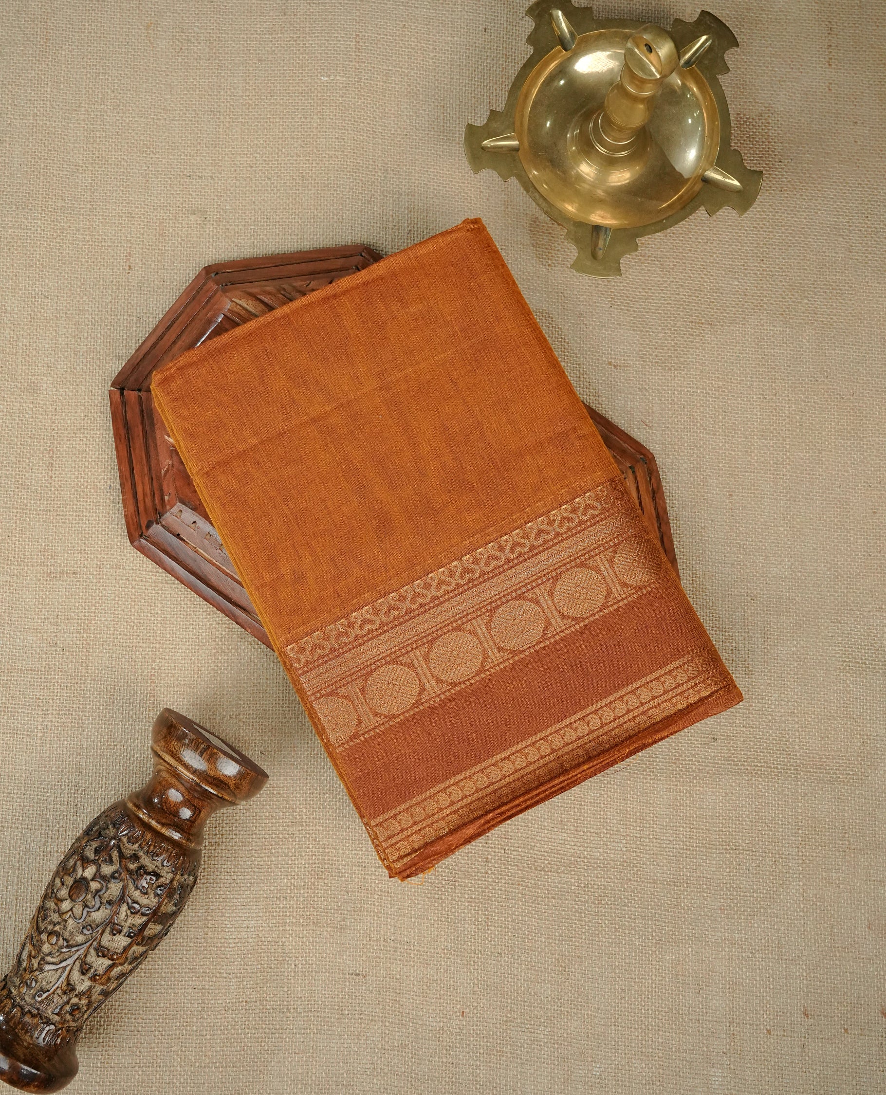 Brown colour chettinad cotton saree featuring Elegant plain body,Self colour with Gold zari border, comes with matching blouse piece.