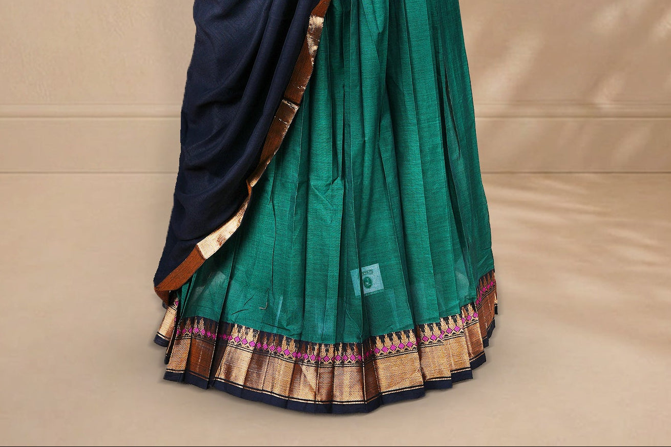 Green colour Half saree featuring Plain skirt with Zari border on contrast black colour border, Unstitched Blouse and matching dupatta.