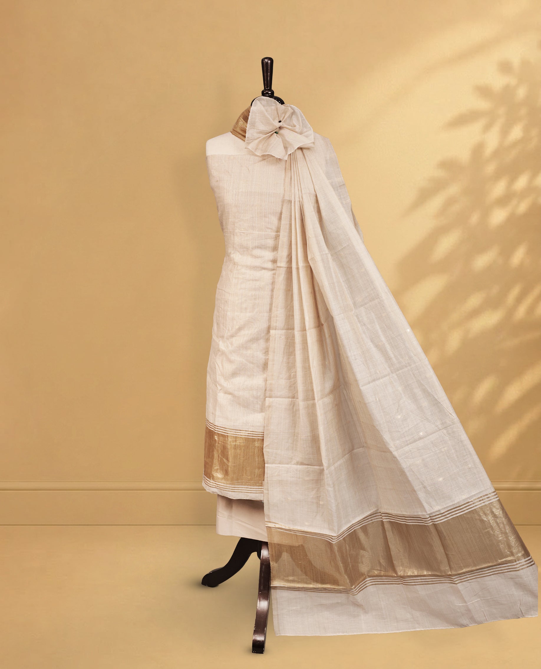 Cream colour Mul Chanderi Salwar Material Featuring Gold zari buttas on body and Gold zari border, Same mul chanderi Zari buttas Dupatta, comes with santoon bottom.
