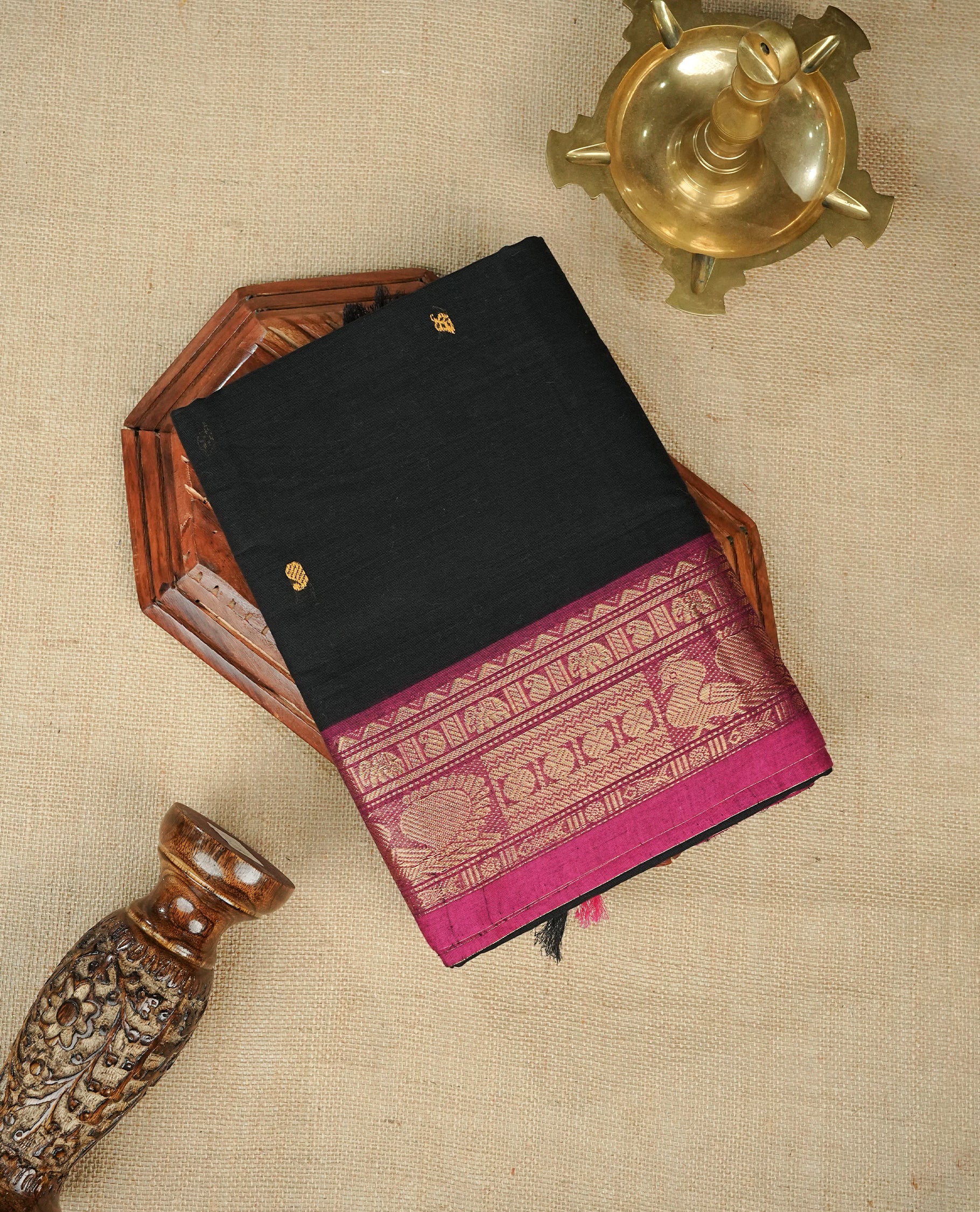 Black Colour Chettinad Cotton Saree Featuring Yellow Colour Mango Motifs on the Body, Complemented by a Magenta Border with Peacock & Mango Gold Zari Pattern and a Contrast Black Pallu, Paired with a Matching Blouse Piece.