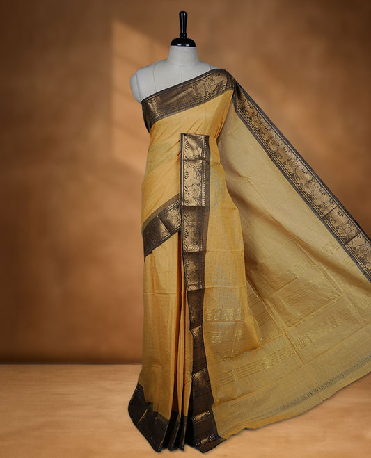 Yellow colour sungudi cotton saree featuring gold zari check pattern across body, contrast colour with gold zari floral kodi pattern on border, without blouse piece.