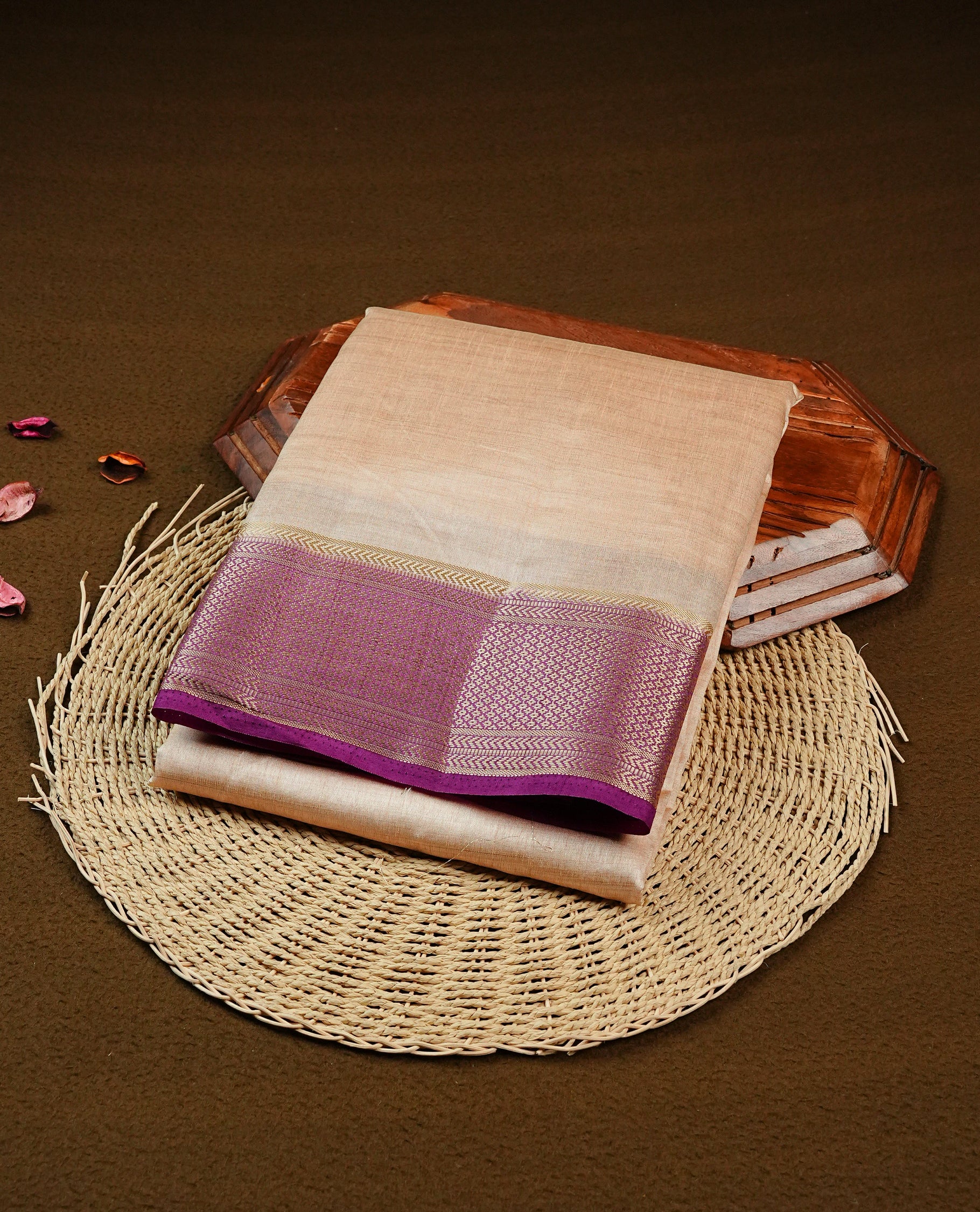 Light Gold Tussar saree featuring Gold zari buttas on body, complemented by contrast Purple Colour with Gold zari border, comes with matching blouse piece.