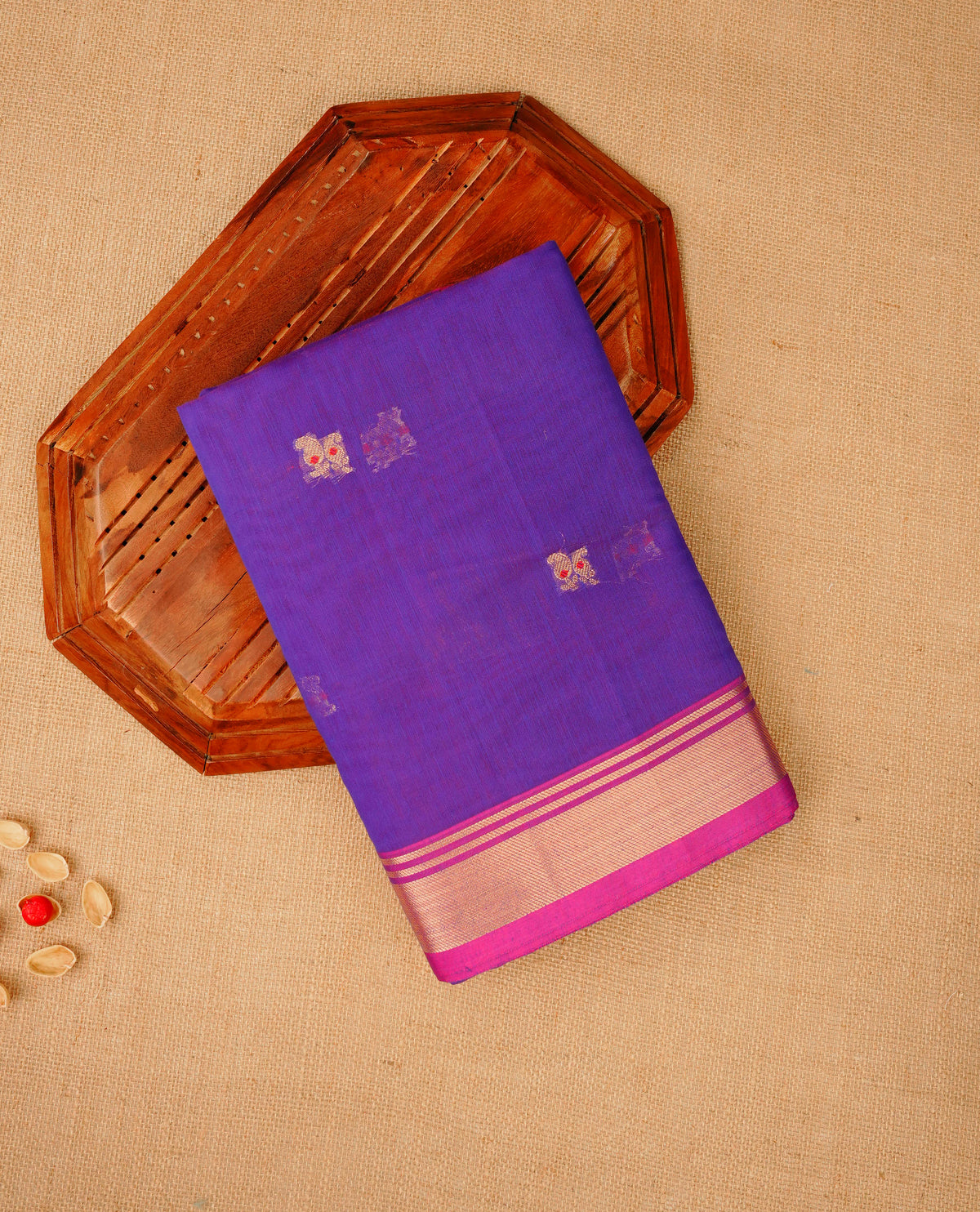 Rich purple colour Maheshwari cotton saree, gold zari floral motifs on body, complement magenta colour gold zari border comes with matching blouse.
