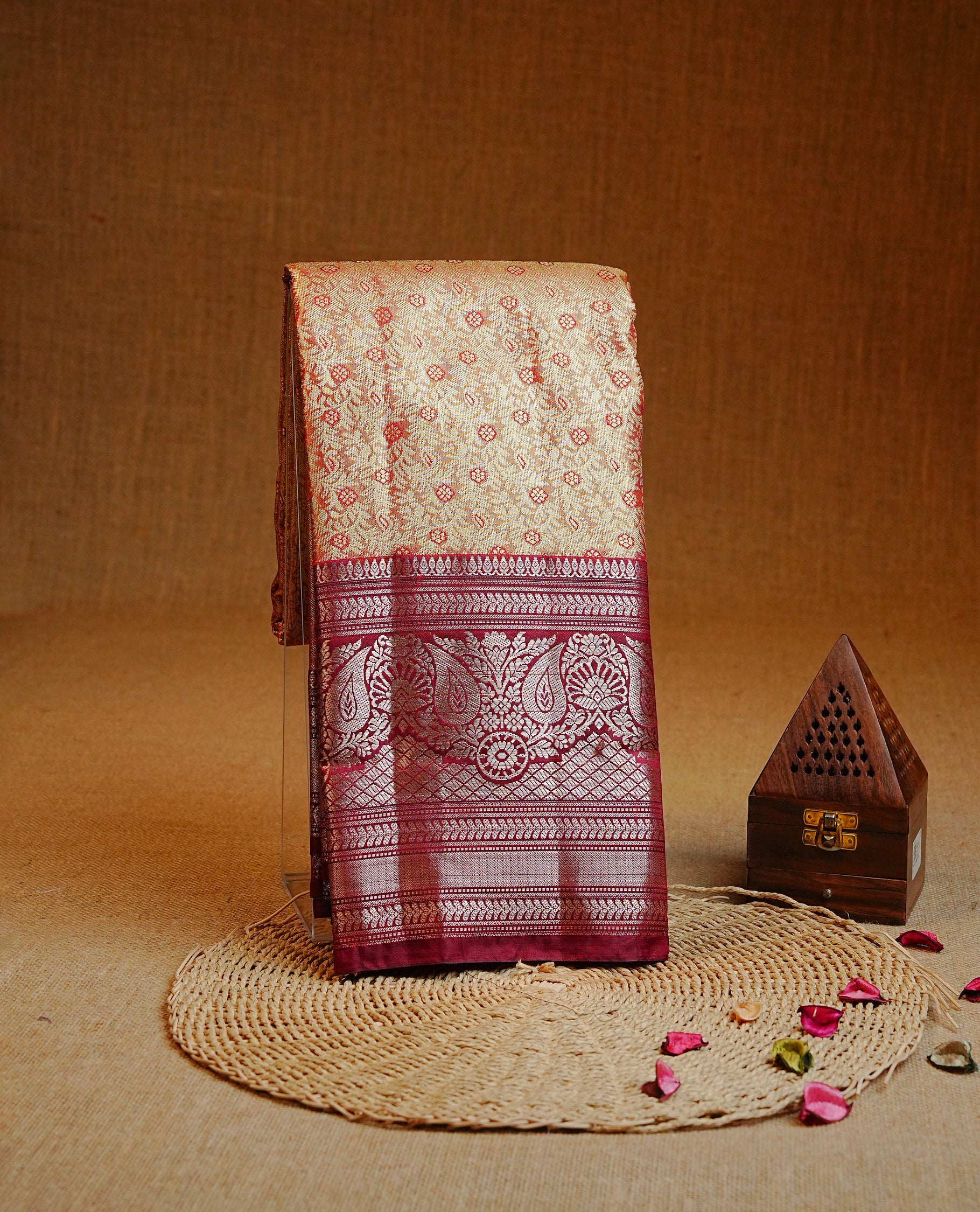 Maroon & gold colour Double shade Semi tissue silk saree featuring self color kodi with Maroon floral motifs on body, Contrast Maroon colour with traditional border, paired with matching.
