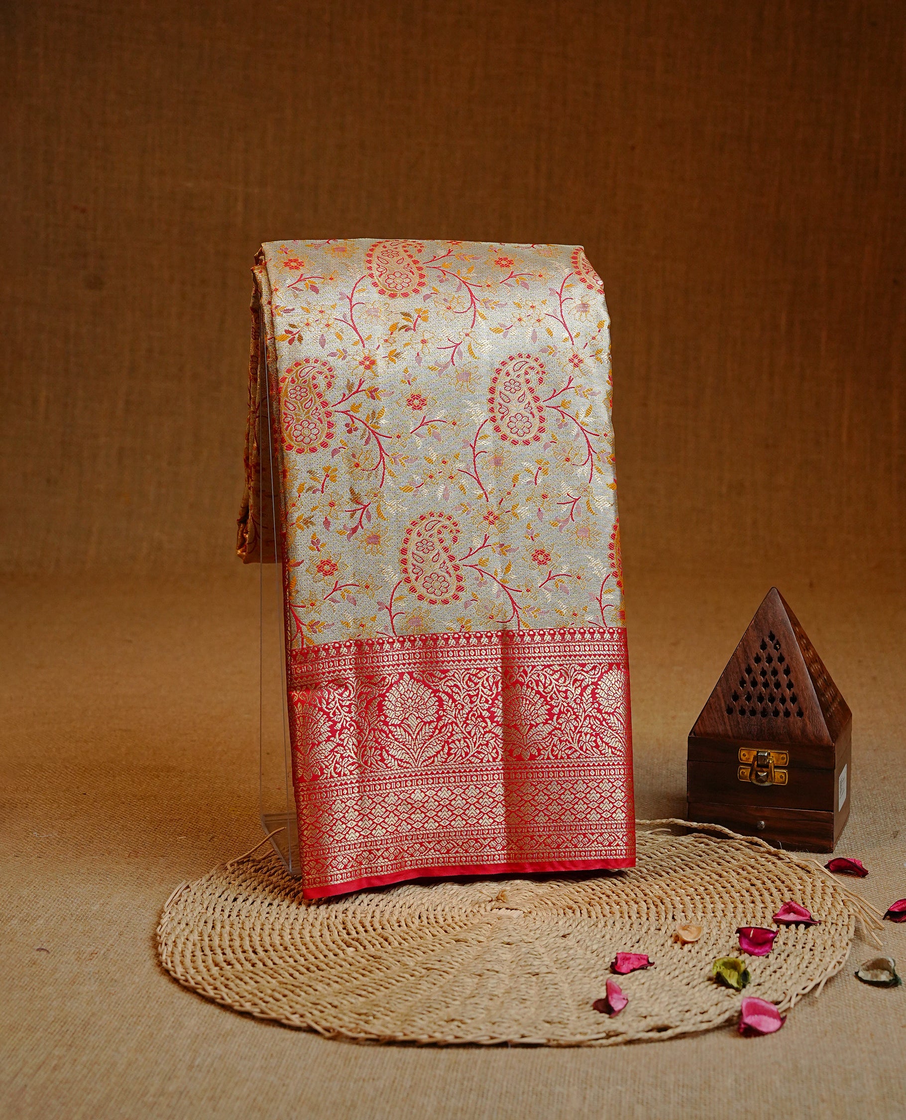 Light gold colour Semi tissue silk saree featuring Gold & Red zari kodi pattern on body, Contrast Red colour with traditional border, paired with matching.