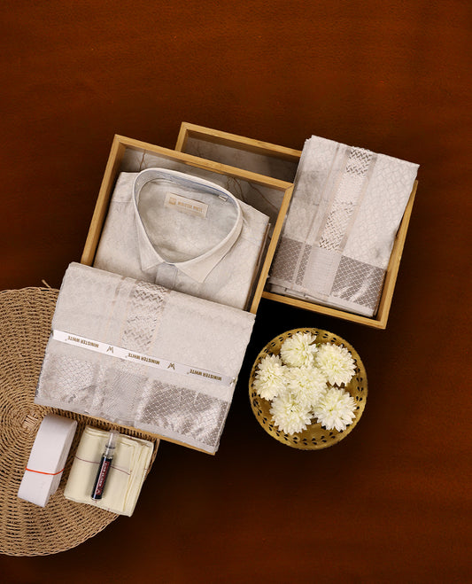 White silver colour MINISTER WHITE jacquard shirt with an all over textured weave, paired with a matching silver zari bordered dhoti featuring intricate geometric patterns, perfect for a refined traditional look.