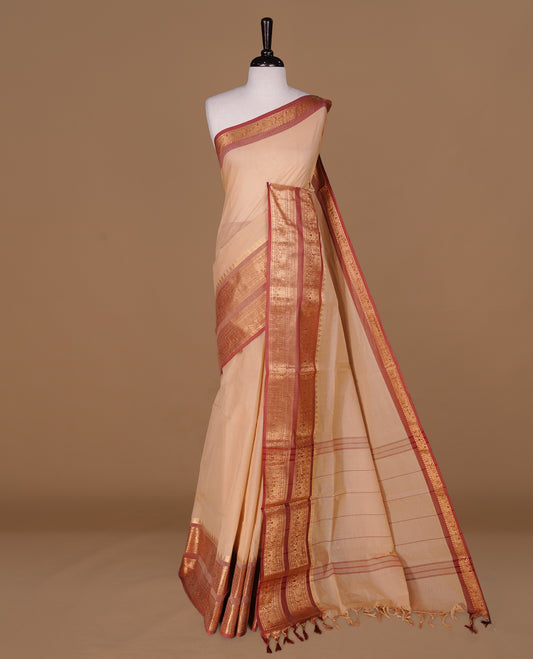 Sandalwood Colour Chettinad cotton saree featuring elegant plain body , complemented by contrast Brickred colour with traditional border, comes with matching blouse piece.