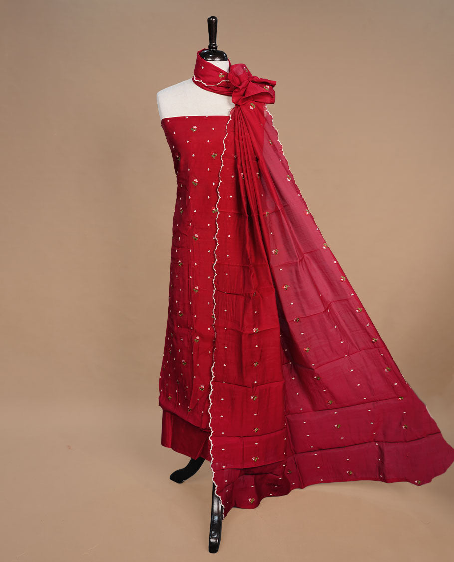 Red colour Mulchanderi salwar suit featuring thread floral buttas on the body and matching dupatta, paired with a santon bottom.